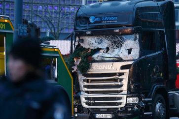 The crashed window of a truck is seen at a Christmas market on Breitscheidplatz square near the fashionable Kurfuerstendamm avenue in the west of Berlin, Germany, December 20, 2016. REUTERS/Hannibal Hanschke