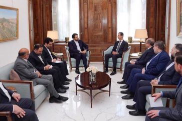 El presidente sirio, Bashar al-Assad, con una delegación económica iraní